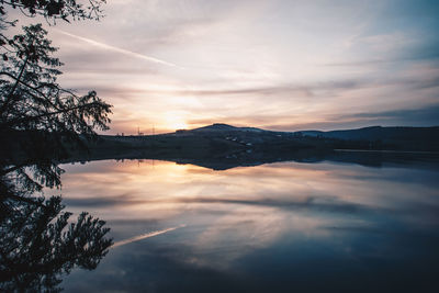 Scenic view of lake against sky during sunset