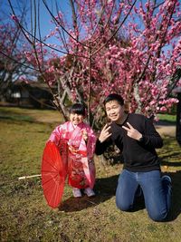 Portrait of father and daughter gesturing