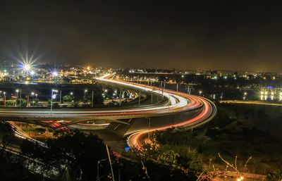 High angle view of illuminated bridge in city at night