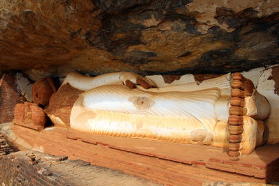 Low angle view of sculpture on rock