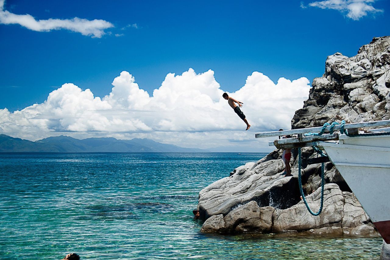 water, sea, sky, blue, horizon over water, nautical vessel, tranquility, tranquil scene, scenics, beauty in nature, nature, transportation, cloud, boat, rock - object, mode of transport, cloud - sky, day, rope, rock formation