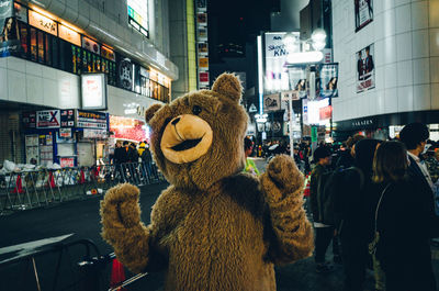 View of store in city at night