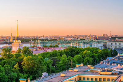 High angle view of buildings against sky at sunset