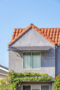 Low angle view of house against clear sky