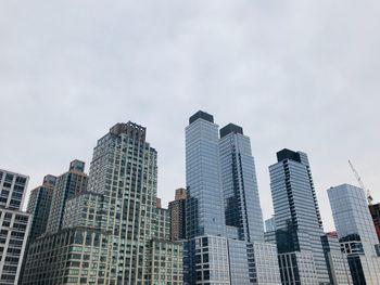 Low angle view of skyscrapers against sky