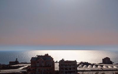 Panoramic view of sea against clear sky during sunset