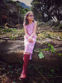 Portrait of beautiful woman standing on land