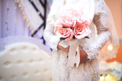 Beautiful bride with bouquet of flowers.