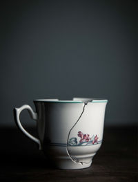 Close-up of coffee cup on table