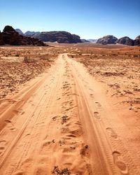 Dirt road passing through a desert