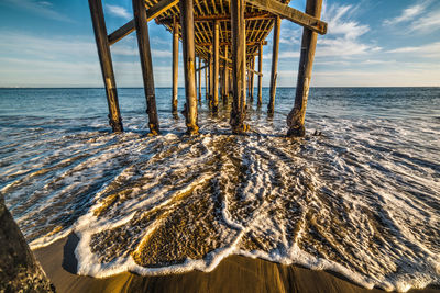 Pier over sea against sky