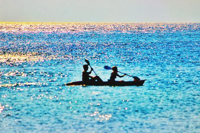 People relaxing in water