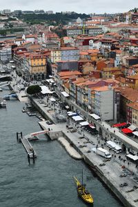 High angle view of townscape by sea