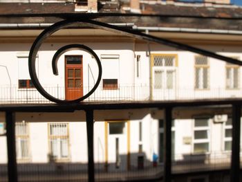 Close-up of building with city in background