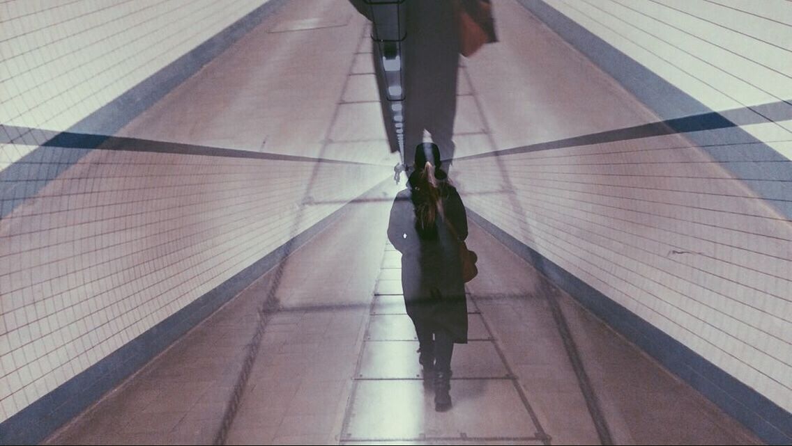 MAN WITH UMBRELLA ON THE ROAD