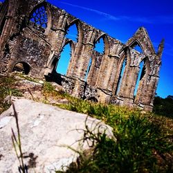 Low angle view of old ruin against clear sky