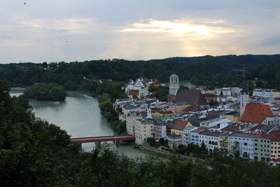 High angle view of river amidst buildings against sky