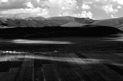 View of mountain range against cloudy sky