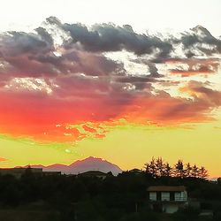 Scenic view of silhouette mountains against sky at sunset
