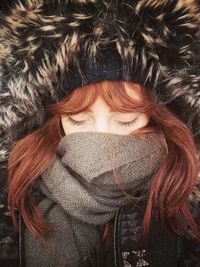 Close-up portrait of a girl in snow