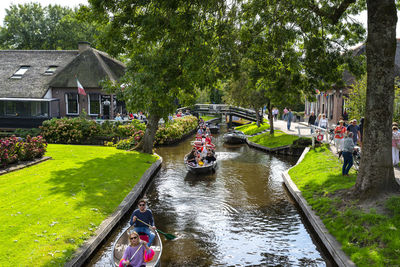 Giethoorn, netherlands - 13 september 2020. tourists sailing on rented boats on the canal.