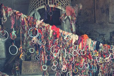 Bangles tied on bamboo outside old temple
