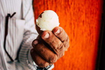 Close-up of hand holding ice cream