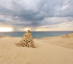 Scenic view of sea against cloudy sky