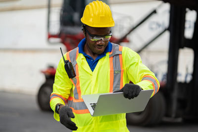 Man working with yellow umbrella