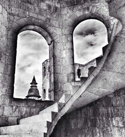 Low angle view of historic building against cloudy sky