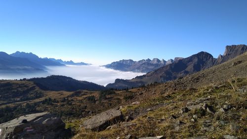 Scenic view of mountains against clear blue sky