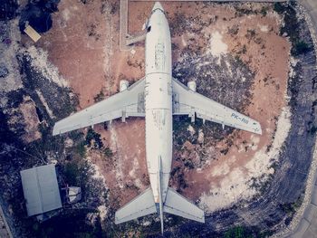 High angle view of airplane on airport runway