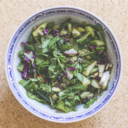 High angle view of chopped vegetables in bowl on table