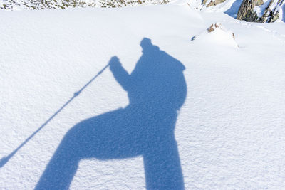A mountaineer woman walking in snowy mountain