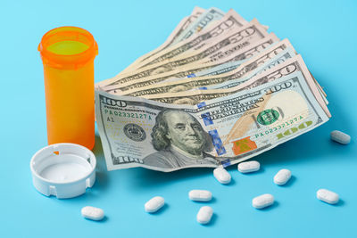 High angle view of dices on blue background