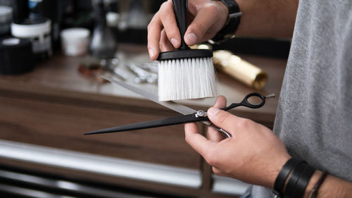 Cropped hand of person working on table