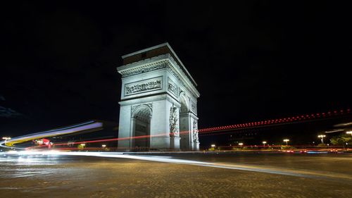 Low angle view of light trails at night