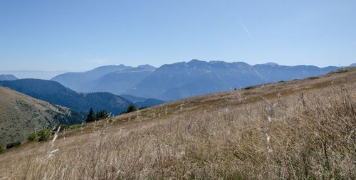 Scenic view of mountains against clear blue sky