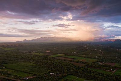 High angle view of field against sky during sunset