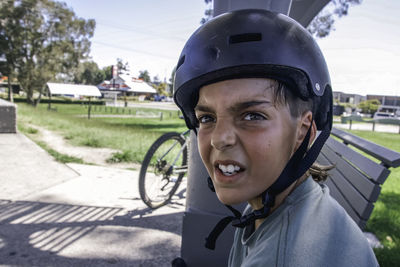 Close up portrait of boy wearing a protective helmet