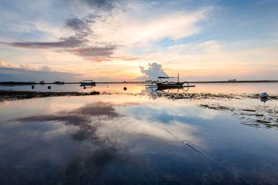 Scenic view of sea against sky at sunset