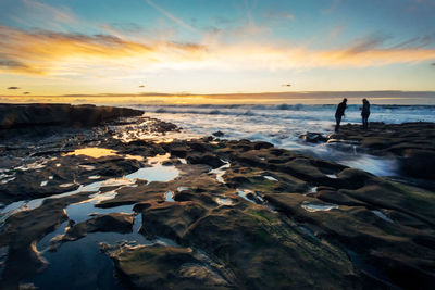 Scenic view of sea at sunset