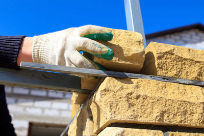 Close-up of person working on wood