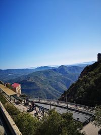 High angle view of road against clear blue sky