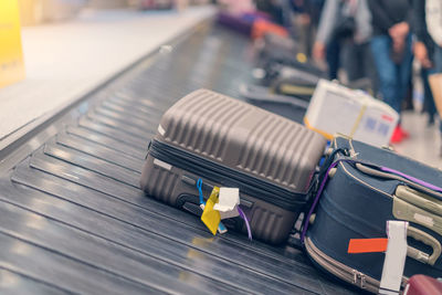 High angle view of luggage on conveyor belt at airport