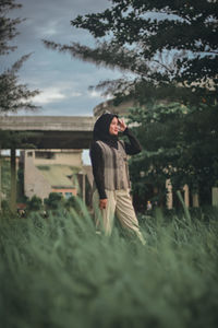 Woman standing on field