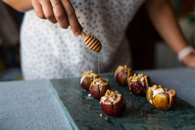 Midsection of person preparing food on table