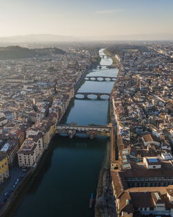 Aerial view of florence along the arno river and the old town from above, tuscany, italy,