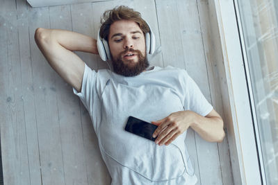 Portrait of young man using mobile phone