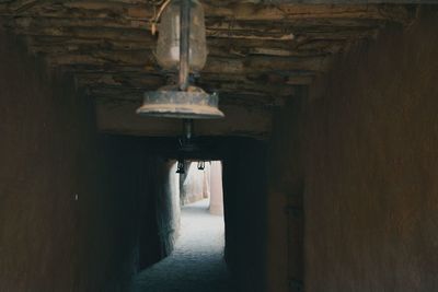 Rear view of man walking in tunnel